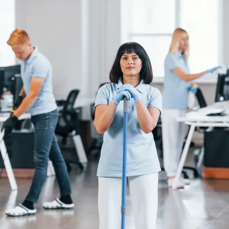 cleans-floor-group-of-workers-clean-modern-office-2023-11-27-04-49-39-utc (1)